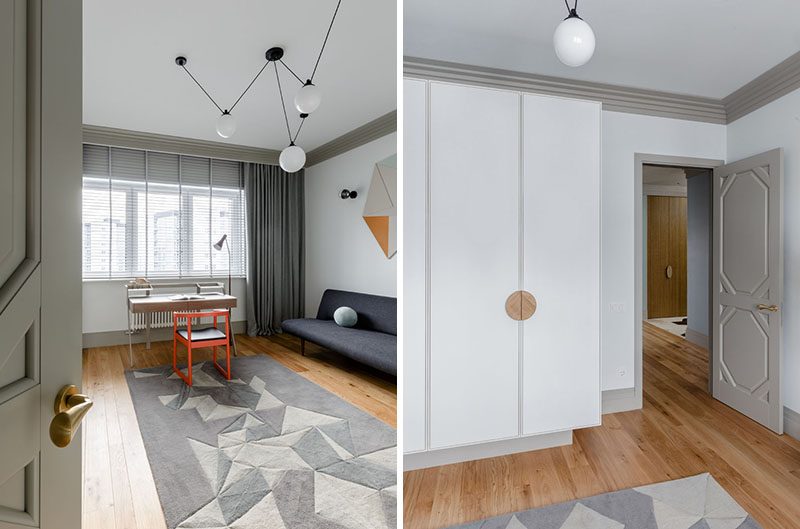 In this home office, a geometric rug partially covers the floors, and a tall closet provides storage. #HomeOffice #ModernInterior