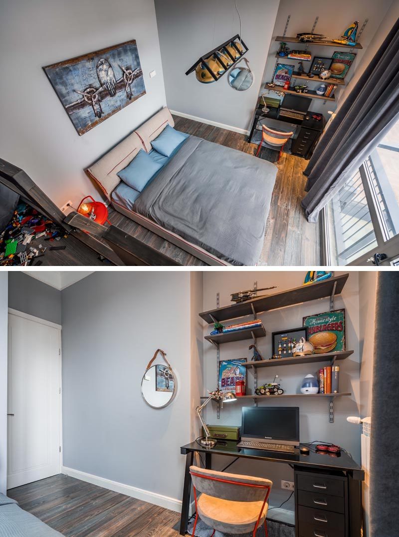 Looking down from a lofted sitting area in this modern bedroom, you can see a small alcove that's home to a small desk with wood shelving above. #Desk #BedroomDesk #HomeworkStation #StudyArea #BedroomIdeas