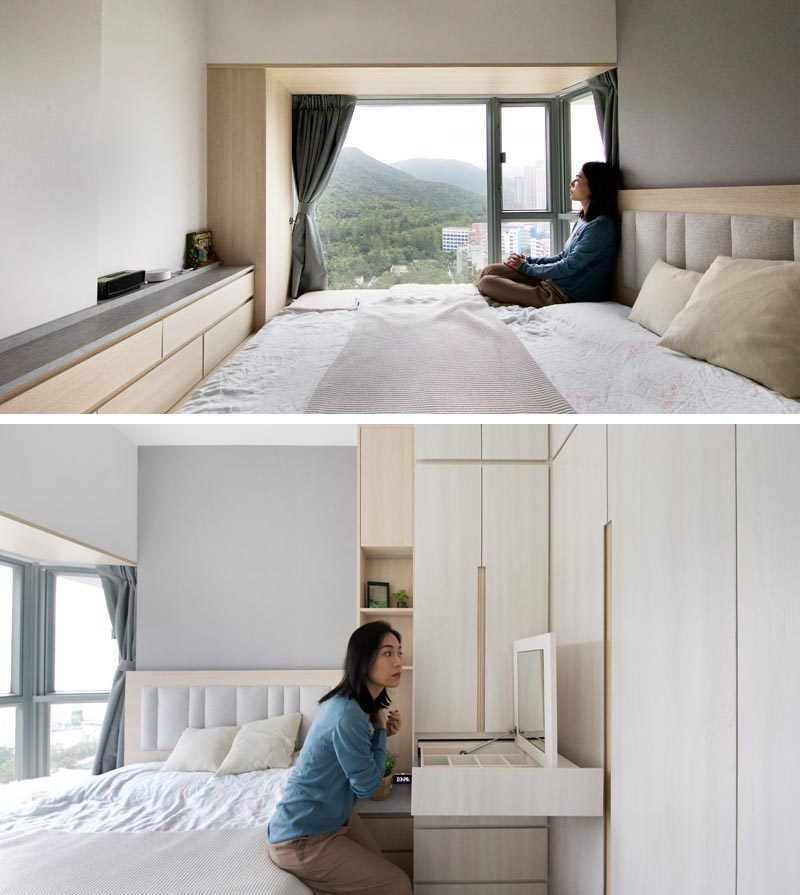 In the master bedroom of this small apartment, there's wood that lines an alcove by the window, while a cabinet runs the length of the room, and a closet as a pull-out make-up vanity. #BedroomDesign #SmallBedroom #Closet