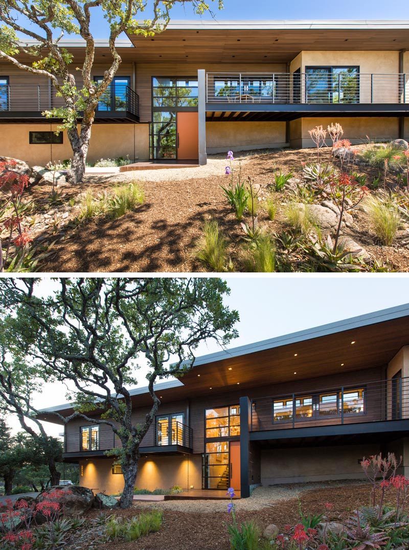 Lighting on the eaves and under the balcony highlight this modern house at night. The double height windows by the front door add natural light to the home, while at night they create a lantern-like appearance. #ModernHouse #Architecture #Landscaping