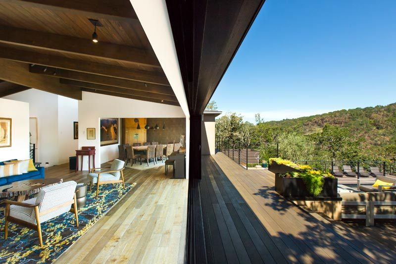 This modern house has a long deck that runs the length of the home. #Architecture #Balcony