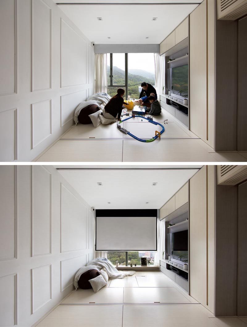 This minimal living room has a dining table hidden within the floor, and can also be used as a playroom and media room. #LivingRoom #Playroom #MediaRoom