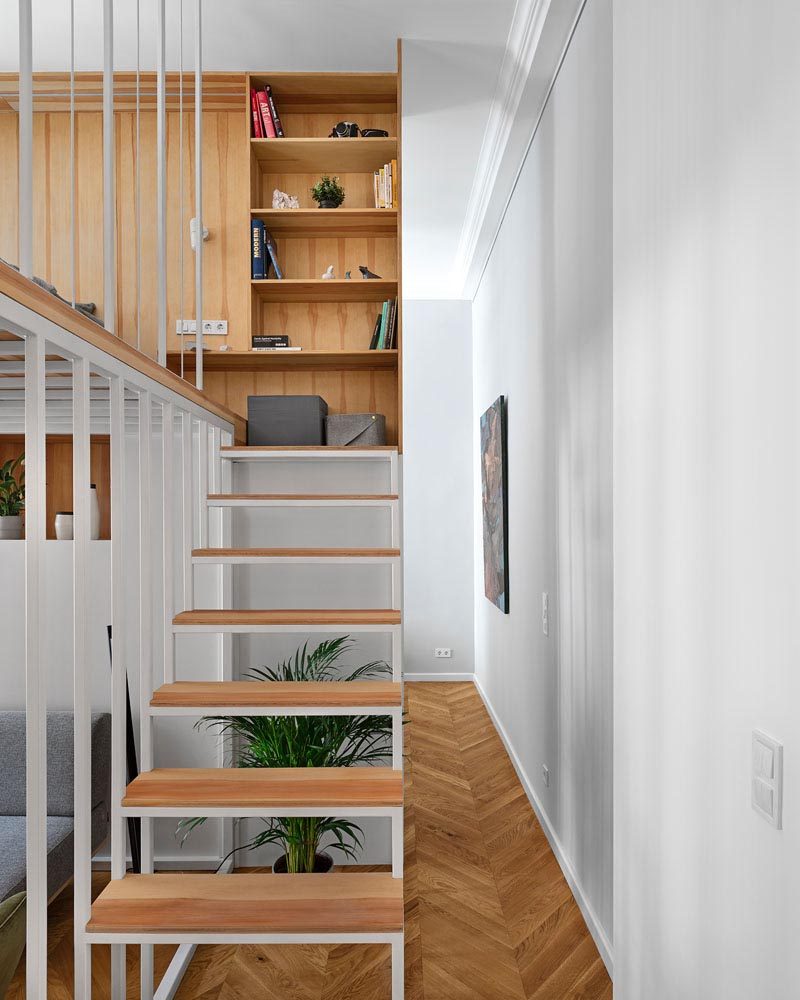 This modern apartment has stairs that lead up to a mezzanine loft bedroom. #Stairs #ModernStairs