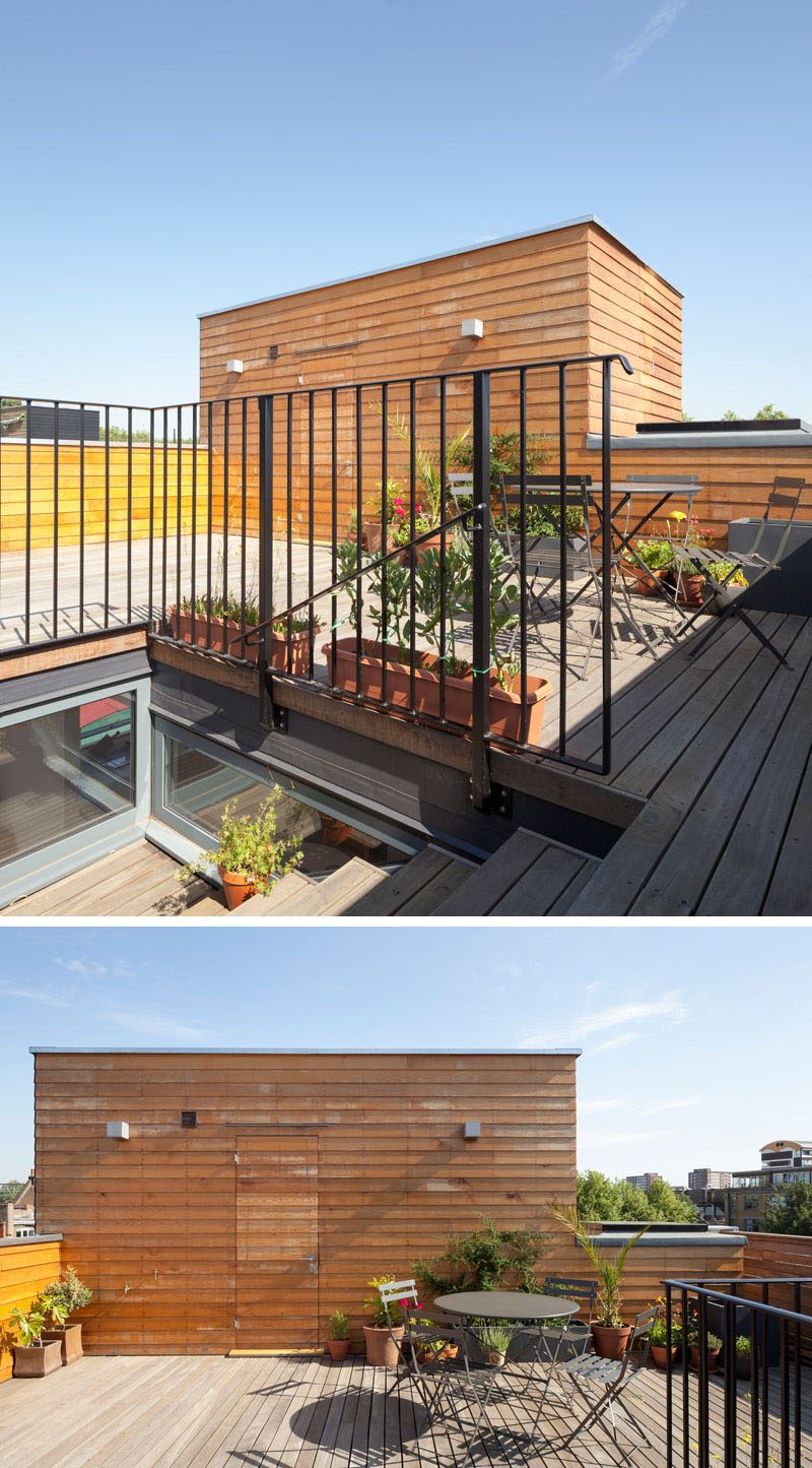 This modern house has a rooftop deck that's furnished with a simple table and chairs set. #RooftopDeck