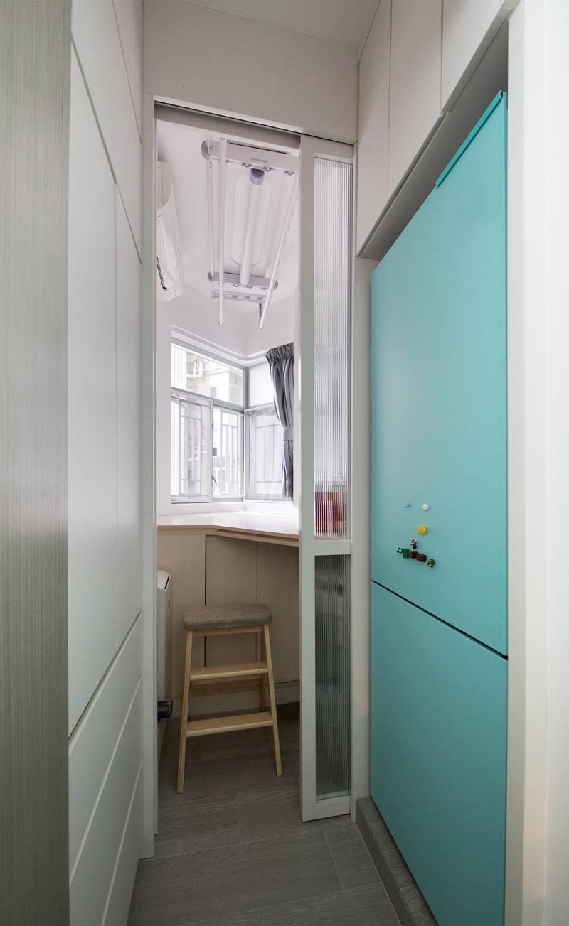 This small apartment has a pocket door that opens to reveal a guest room with storage space. #PocketDoor #SmallApartment