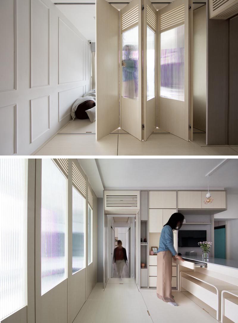 In this small apartment, folding doors that seamlessly blend into the wall next to the television, can be opened to separate the living area from the rest of the apartment. #FoldingDoors #SmallApartmen #DoorIdeas