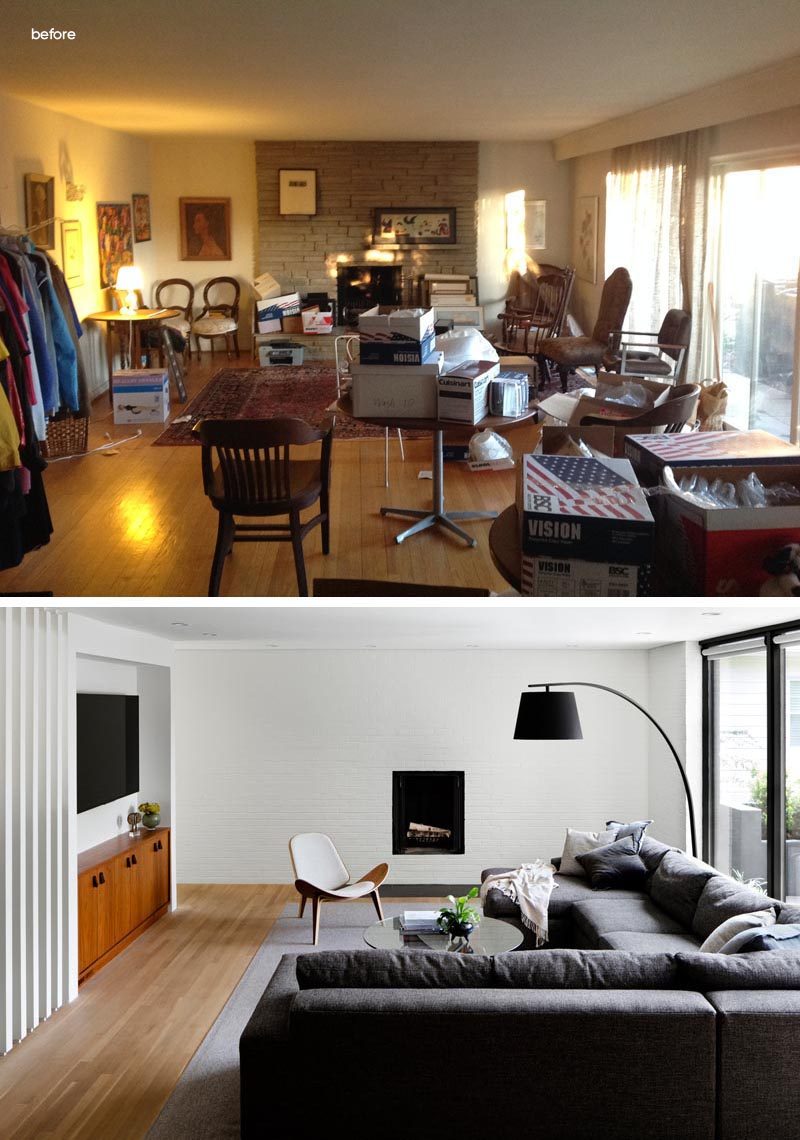 Before & After - In this living room, the stone surround and hearth of the fireplace was removed to create a minimalist appearance. An opening was created in the corner, which now leads to a powder room, a study, and the front door. #LivingRoomRemodel #ModernLivingRoom