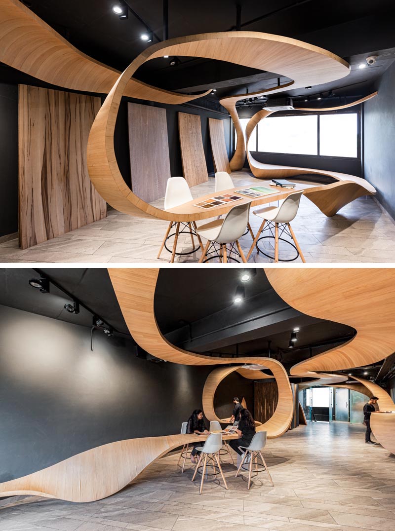 Studio Ardete has designed a ribbon-like sculptural wood installation for their client who sells veneers and plywood. #Wood #Design #RetailDesign