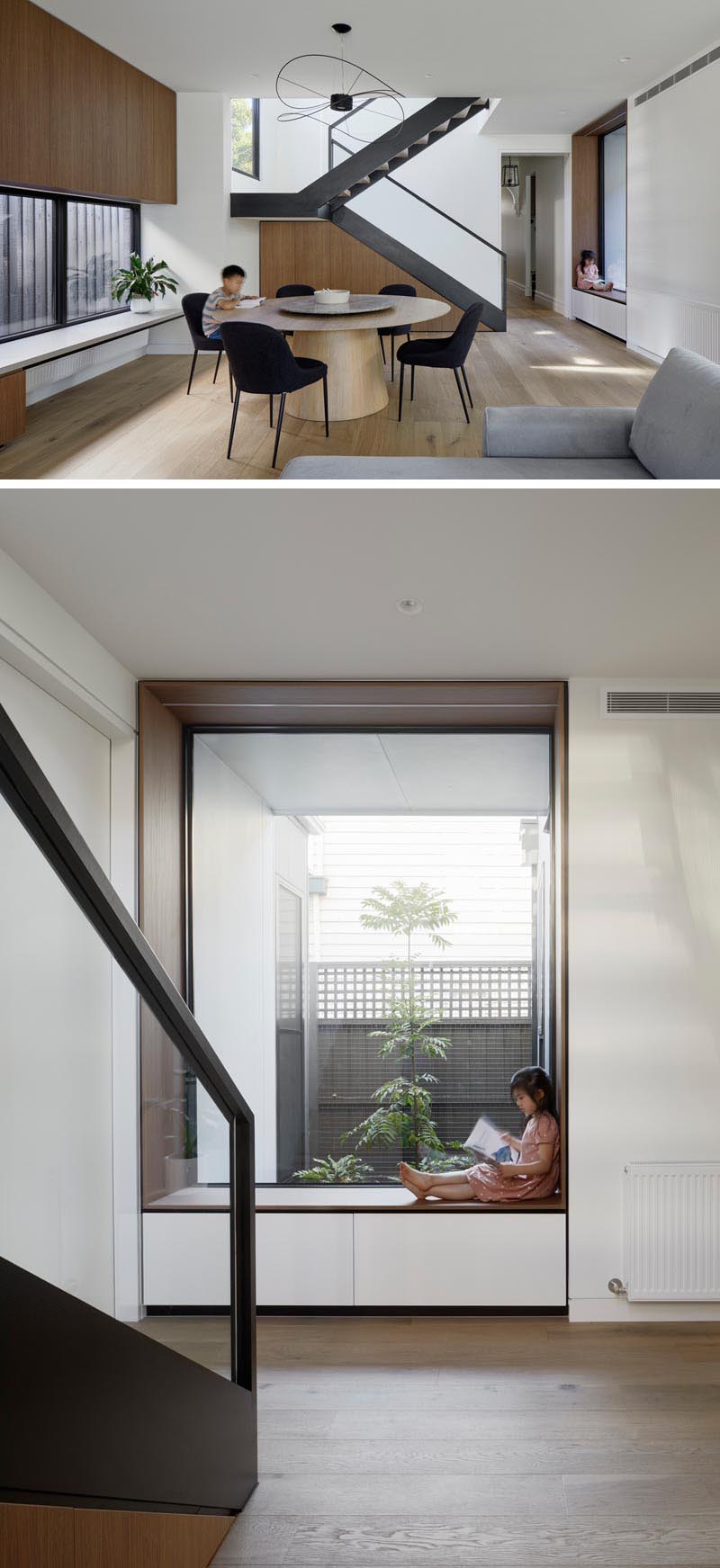 Adjacent to the living room in this modern house is an open dining room with a round table and minimalist sculptural pendant light. Steel stairs lead up to the new second floor, while at the bottom of the stairs, there's a built-in wood-lined window seat that looks out to a small garden at the side of the home. #ModernDiningRoom #WindowSeat #BuiltInWindowSeat