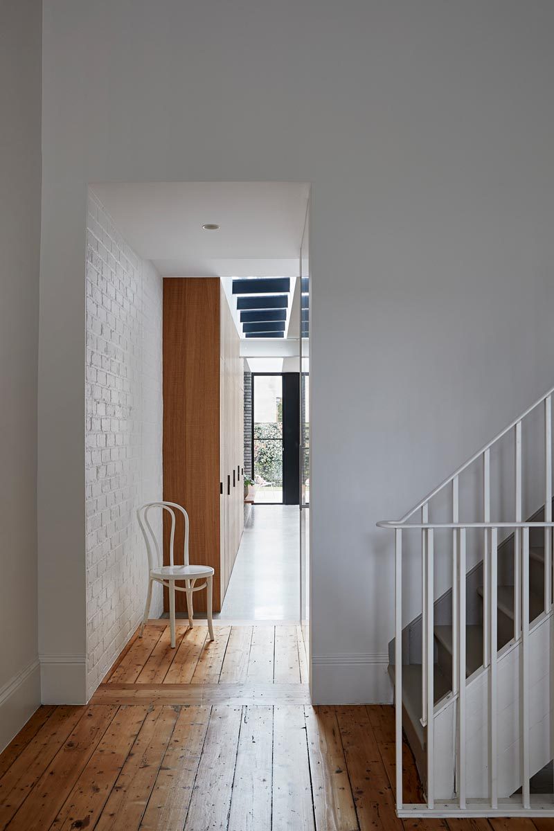 Studio Tom has transformed a general store in Melbourne, Australia, into a modern house for a Melbourne couple and their two young daughters. #HouseExtension #WhitePaintedBrick #WoodFloors