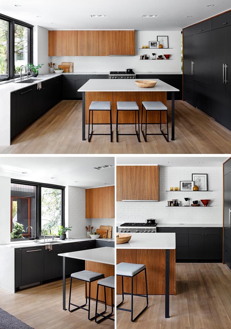 This bright and modern kitchen has black cabinets, with integrated appliances, that are combined with white counters and warm wood cabinetry, while minimalist black shelving provides a place to showcase a variety of objects. #ModernKitchen #BlackCabinets #KitchenDesign