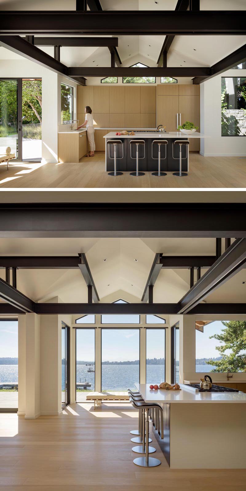 In this modern kitchen, light wood cabinets are complemented by white countertops, while dark cabinets on the kitchen island tie in with the black beams above. #KitchenDesign #LightWoodCabinets #ModernKitchen #Windows