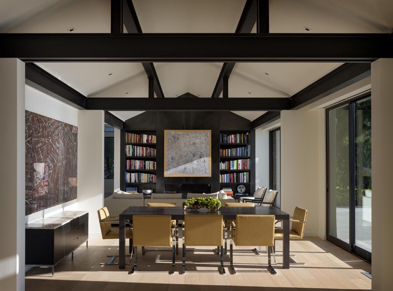 Heavily articulated log and timber columns and beams were removed and replaced with a thin steel framework, opening up the space both physically and visually. #Architecture #InteriorDesign #ModernHouse