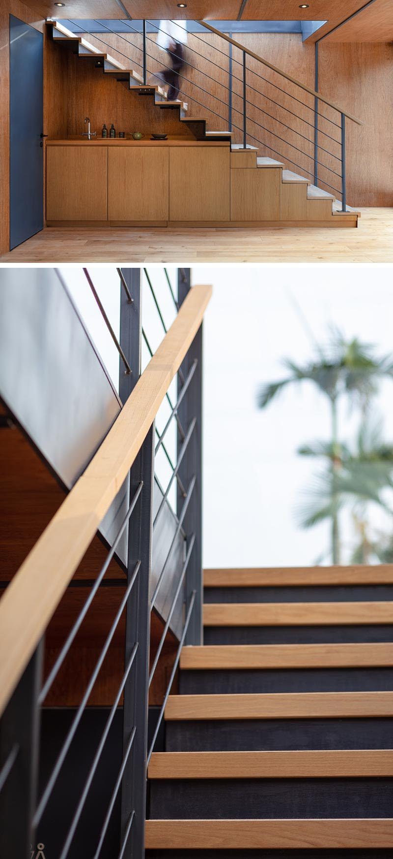 Industrial touches like this steel and wood stairs with a matching handrail, connect two levels of a modern marketing suite made from multiple shipping containers. #Stairs #SteelStairs #StairDesign #ModernStairs
