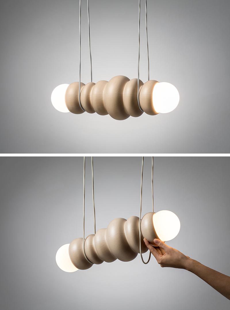Studio Sain has collaborated with woodturner Hermann Viehhauser to create Bulbous, a collection of modern home decor items that include a shelf, a mirror, a hanging lamp, and a table lamp, some with movable parts. #Design #LightingDesign #WoodDecor #WoodLighting #ModernDecor