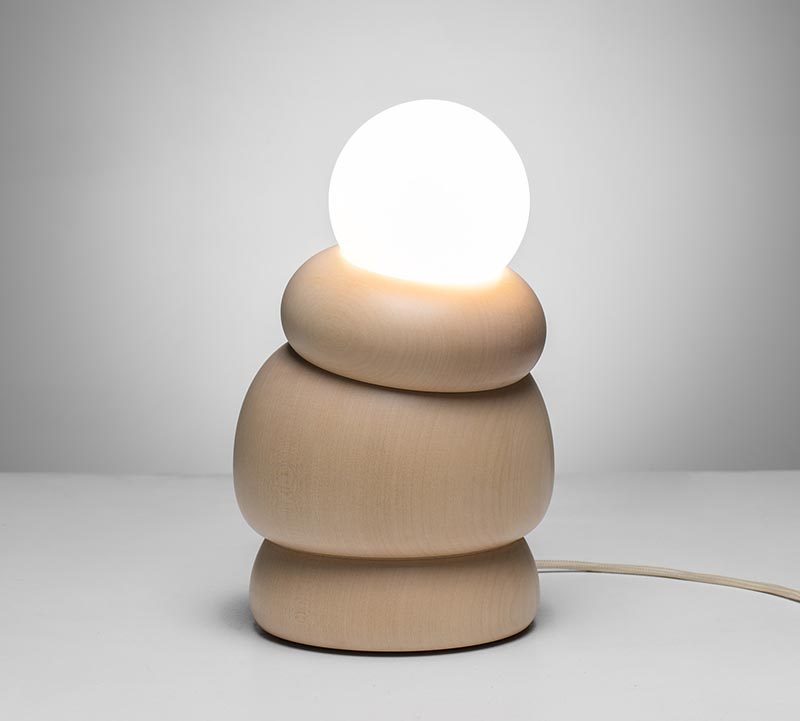 Studio Sain has collaborated with woodturner Hermann Viehhauser to create Bulbous, a collection of modern home decor items that include a shelf, a mirror, a hanging lamp, and a table lamp, some with movable parts. #Design #LightingDesign #WoodDecor #WoodLighting #ModernDecor