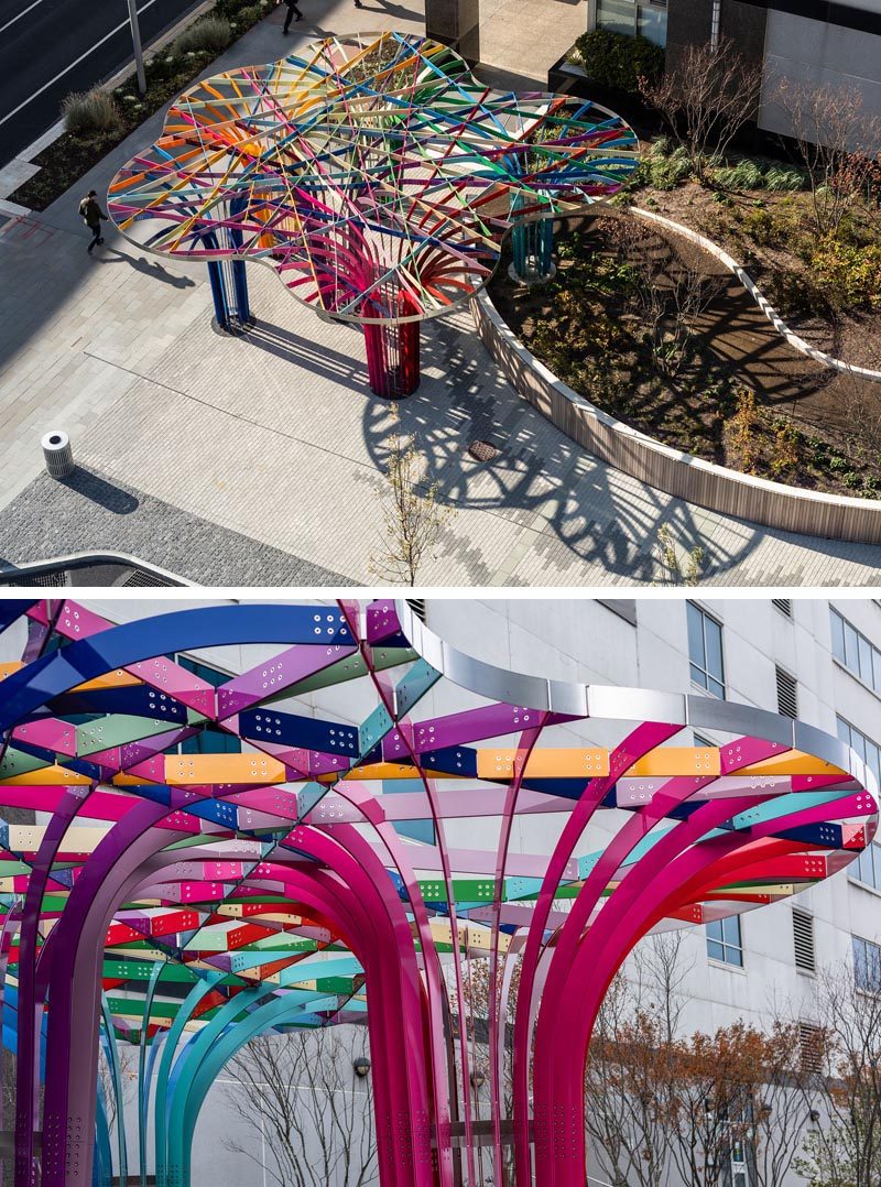 This modern public art installation invites visitors to walk through a grove of archways that have been woven together from intersecting bands of powder-coated aluminum in 28 colors. #PublicArt #PublicInstallation #PublicSculpture #ModernArt #ModernSculpture #Design