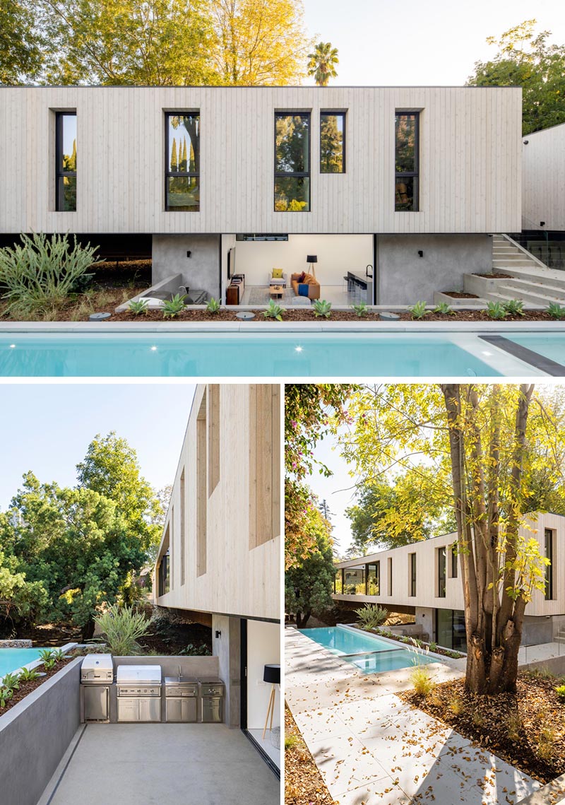 This modern house has a basement that opens to an outdoor kitchen with a bbq, while steps lead up to the pool and garden. #ModernArchitecture #Basement #SwimmingPool #OutdoorKitchen