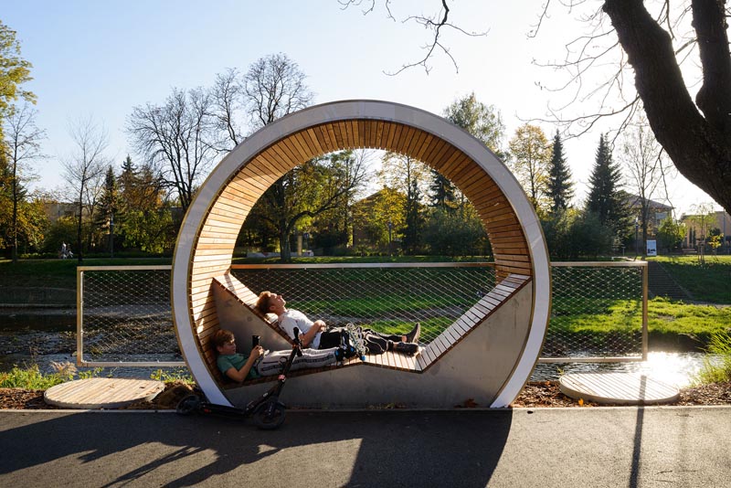 The Time Circles line the river in Cieszyn, Poland, and provide a place to relax and enjoy the view. They also act as an outdoor museum, with attached plaques allowing people to learn about the history of the area. #PublicSeating #OutdoorSeating #Design #PublicFurniture