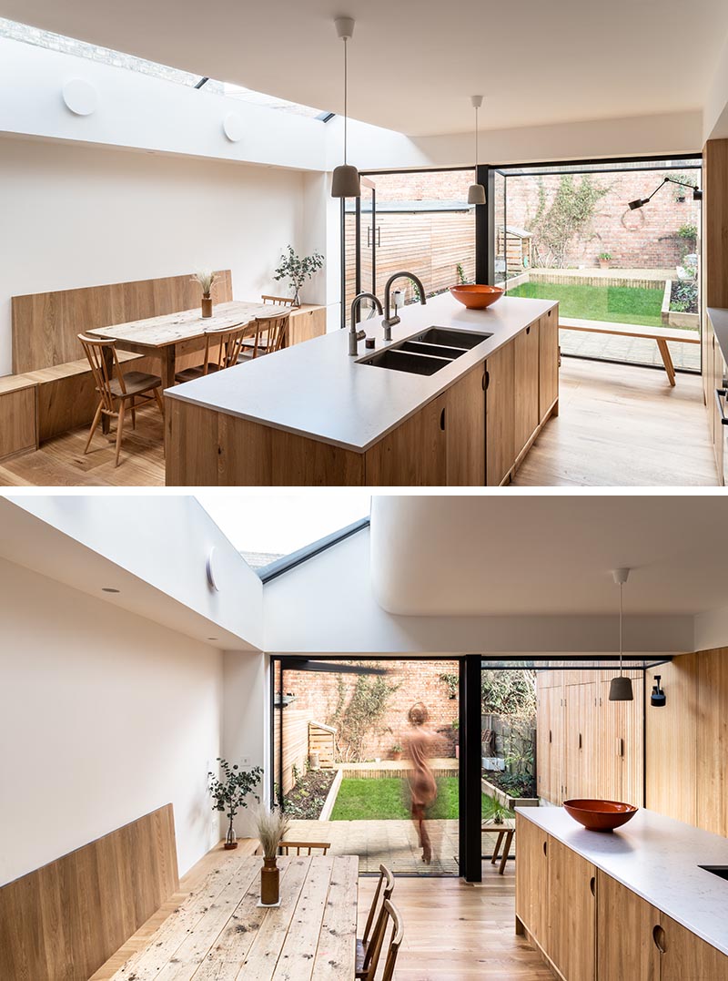 Kitchen Ideas - To stay within their budget, the designers created a kitchen using standard off-the-shelf kitchen units, but they had bespoke natural oak fronts and facing dividers made that included small cut-out finger pulls instead of hardware. #ModernWoodKitchen #HardwareFreeKitchen #KitchenDesign #OakCabinets