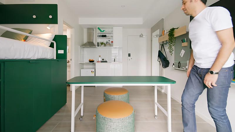 Designed for Sydney co-living space UKO, the small 204 square foot (18sqm) apartment has been designed in a way that lets the occupants customize their space when needed, and a big part of that, is the platform bed that hides a wardrobe, a dining table, and a couch. #PlatformBed #HiddenStorage #SmallLiving #SmallApartment #UnderBedStorage