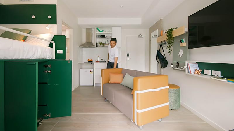 Designed for Sydney co-living space UKO, the small 204 square foot (18sqm) apartment has been designed in a way that lets the occupants customize their space when needed, and a big part of that, is the platform bed that hides a wardrobe, a dining table, and a couch. #PlatformBed #HiddenStorage #SmallLiving #SmallApartment #UnderBedStorage