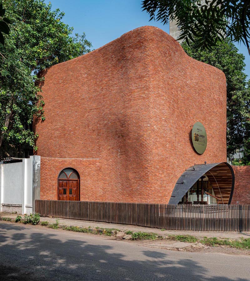 Architectural studio Saransh has designed the KBM Sweet Shop in Ahmedabad, India, that showcases a brick facade with softened edges. #Brick #ModernArchitecture #BuildingDesign
