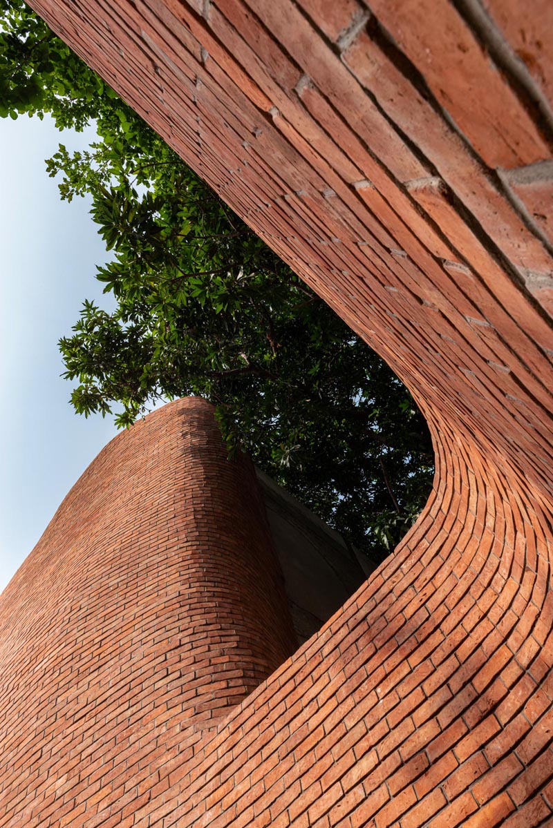 Architectural studio Saransh has designed the KBM Sweet Shop in Ahmedabad, India, that showcases a brick facade with softened edges. #Brick #ModernArchitecture #BuildingDesign