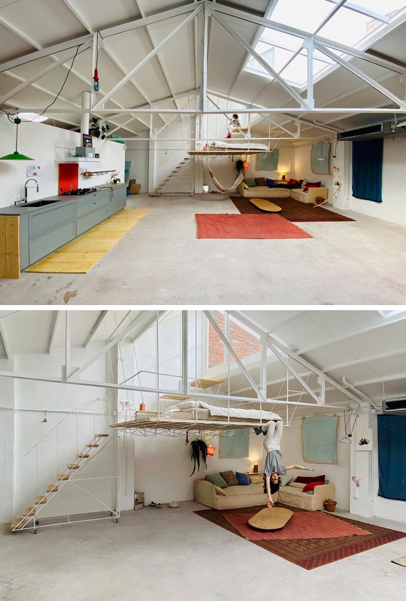 This open plan minimalist apartment was a former warehouse, and features a hanging platform bed made from steel and wood. #PlatformBed #HangingBed #InteriorDesign #BedroomDesign