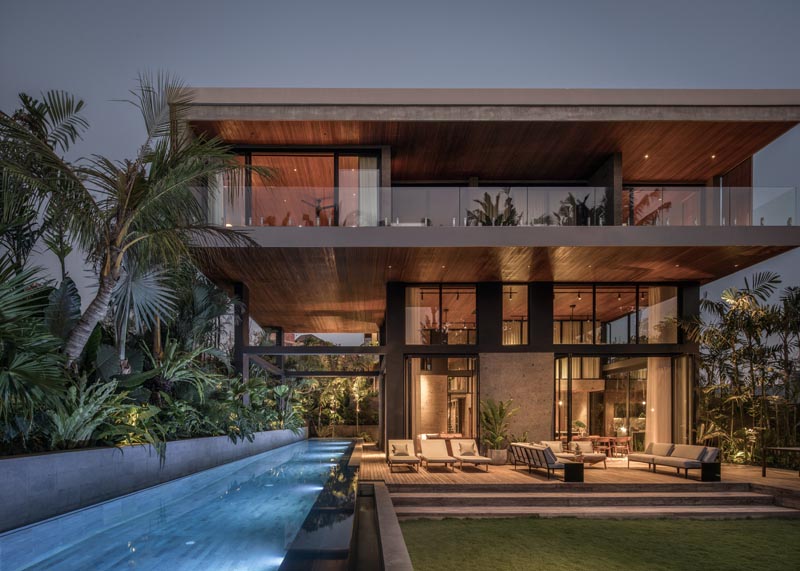 Architect Alexis Dornier has completed 'The River House', a modern home in Pererenan, Bali, that uses reclaimed timber and locally sourced sandstone throughout its design. #ModernHouse #ModernArchitecture #HouseDesign #SwimmingPool #OutdoorSpace