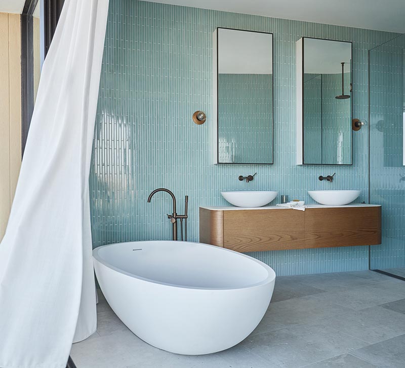 Luigi Rosselli Architects together with Alwill Interiors have recently completed an Australian house that features a soft blue bathroom. #BlueBathroom #ModernBathroom #BathroomDesign