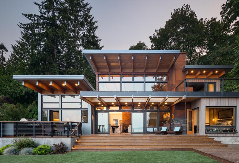 Coates Design has recently completed a Pacific Northwest-style house on Bainbridge Island, Washington, that features a palette of stone, concrete, wood, and metal. #ModernArchitecture #HouseDesign