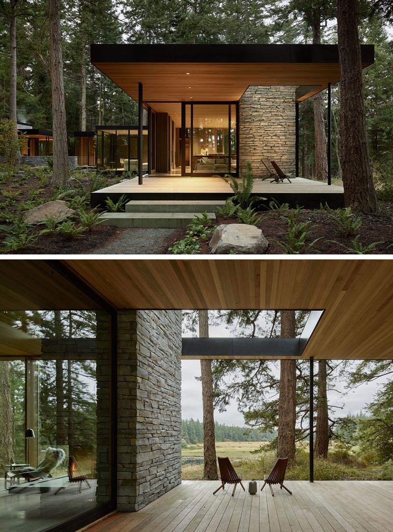 Sliding glass walls open the living room of this modern house to the covered deck outside. #OutdoorSpace #Deck #ModernHouse