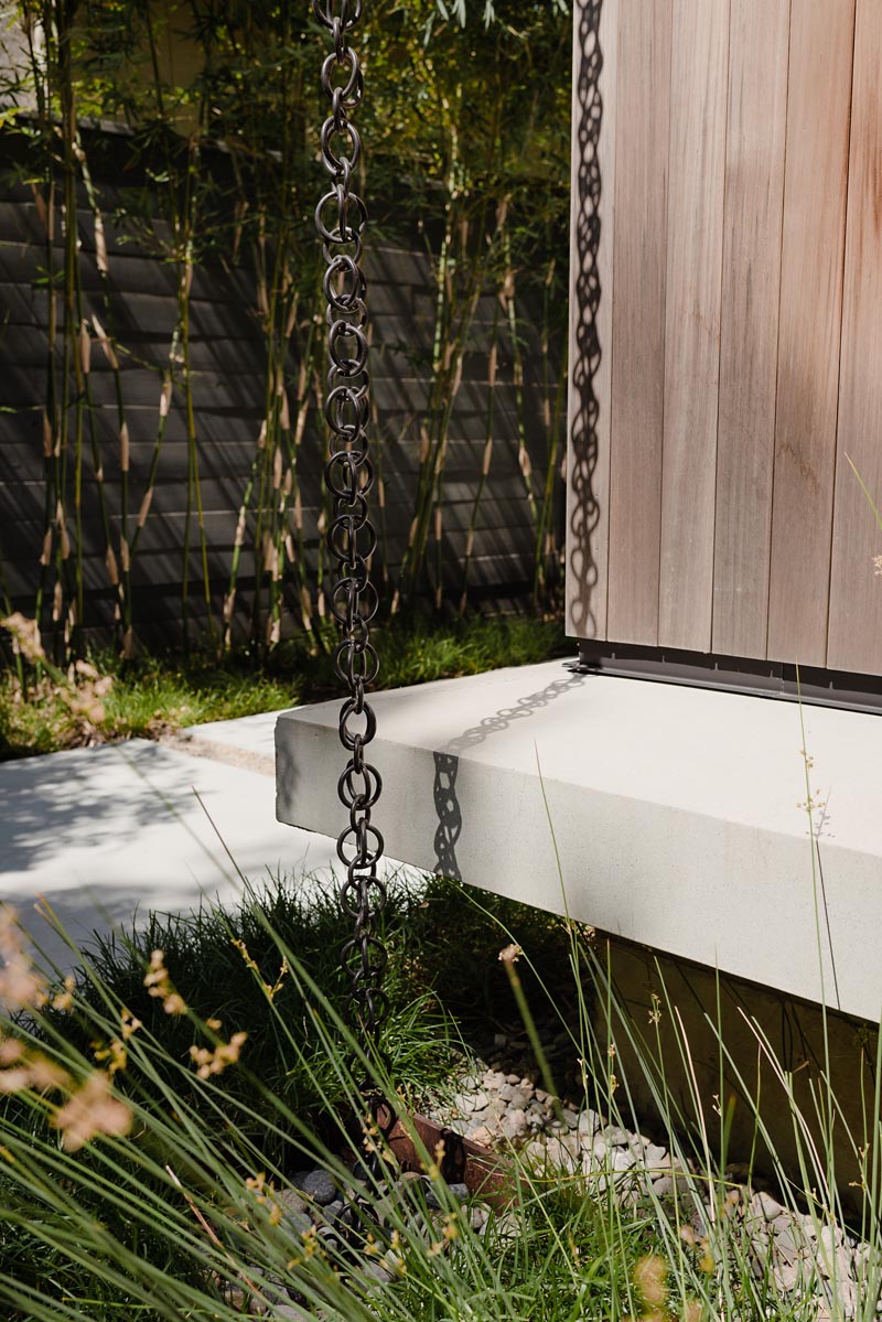 Modern Rain chains are a great way to add a unique design detail to your home as they help direct water away from the foundation of your home, preventing it from weakening over time.  #RainChain #Architecture #ModernRainChain #RainChainIdeas