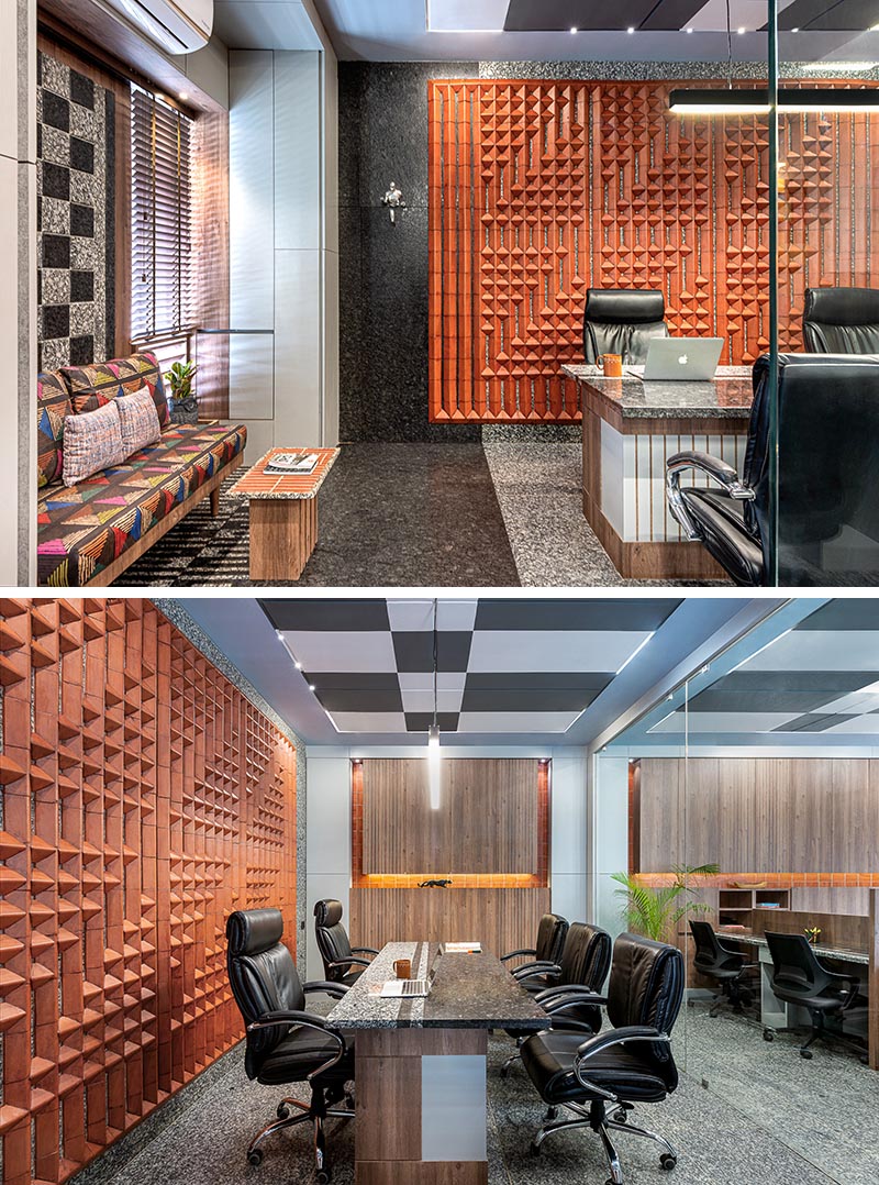 Using a variety of custom terracotta tiles, the designers were able to create a unique large wall art installation that adds interest to the office and complements other tile work found throughout the office. #WallArt #OfficeDesign #TileArt #TerracottaTiles