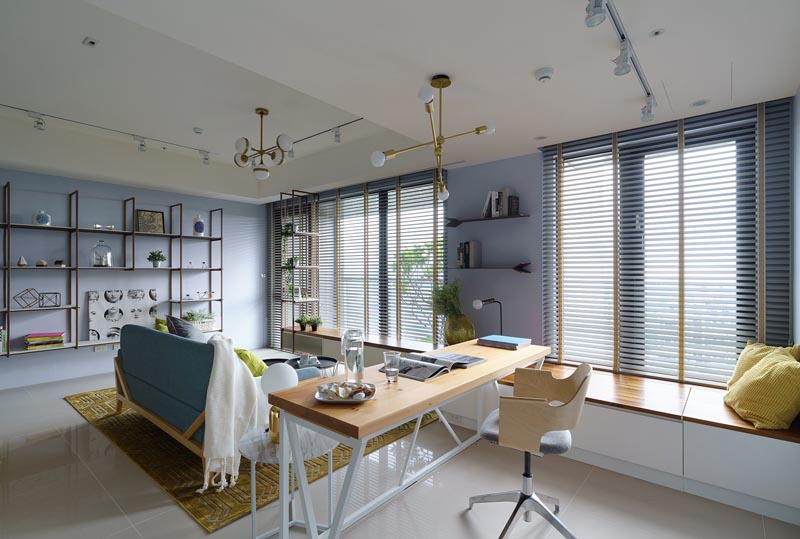 A modern apartment interior with custom-designed desk and window bench. #InteriorDesign #LivingRoom #Desk