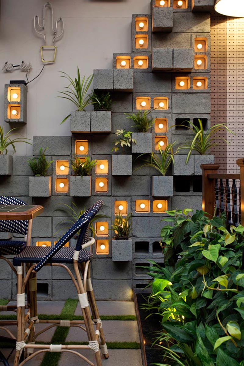 A Concrete Block Planter Wall Was Used To Add Greenery To This Restaurant