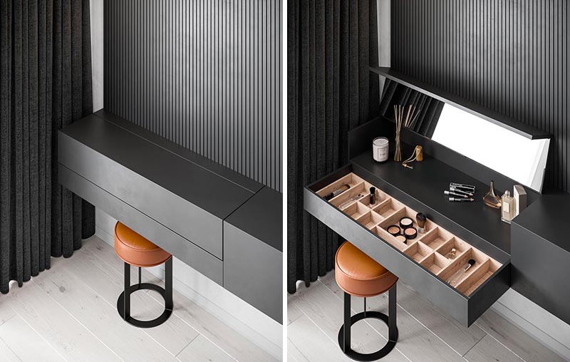 The Interior Workshop by Iryna Lysiuk has designed a master bedroom that features a minimalist black floating sideboard with a hidden make-up vanity. #HiddenMakeupVanity #MakeupVanity #BedroomDesign #FurnitureDesign