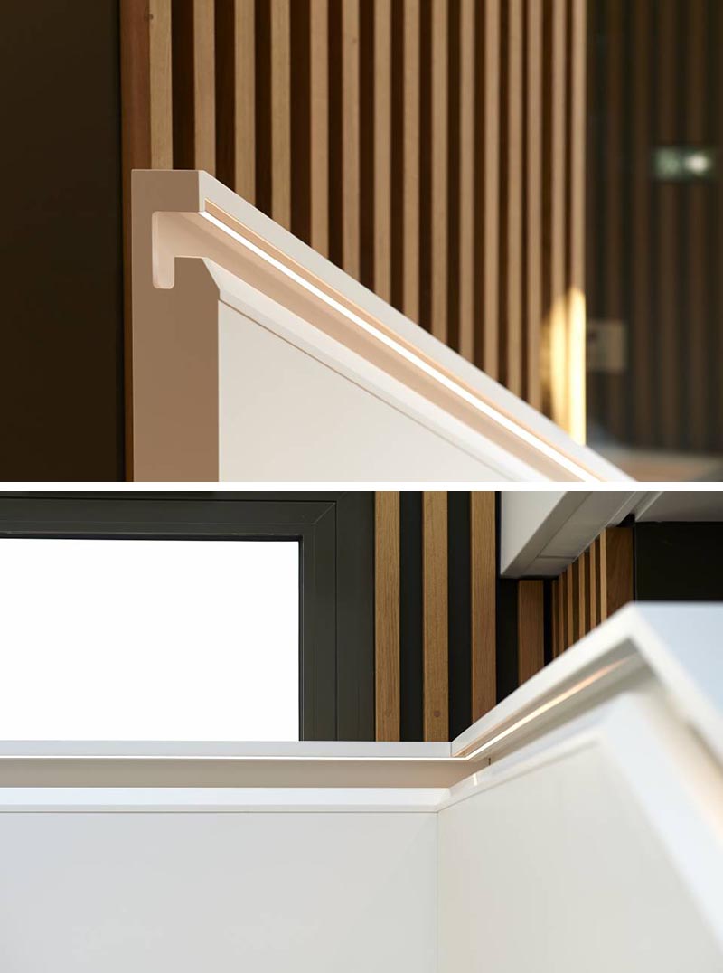 One of the unique details of the staircase design is the inclusion of a built-in handrail. The handrail is perfectly aligned with the inner side and includes recessed joints at the edge of the materials and lighting whose 60° angle illuminates the part of the handrail held by visitors. #Handrail #StairsWithLighting #StairDesign #Staircase