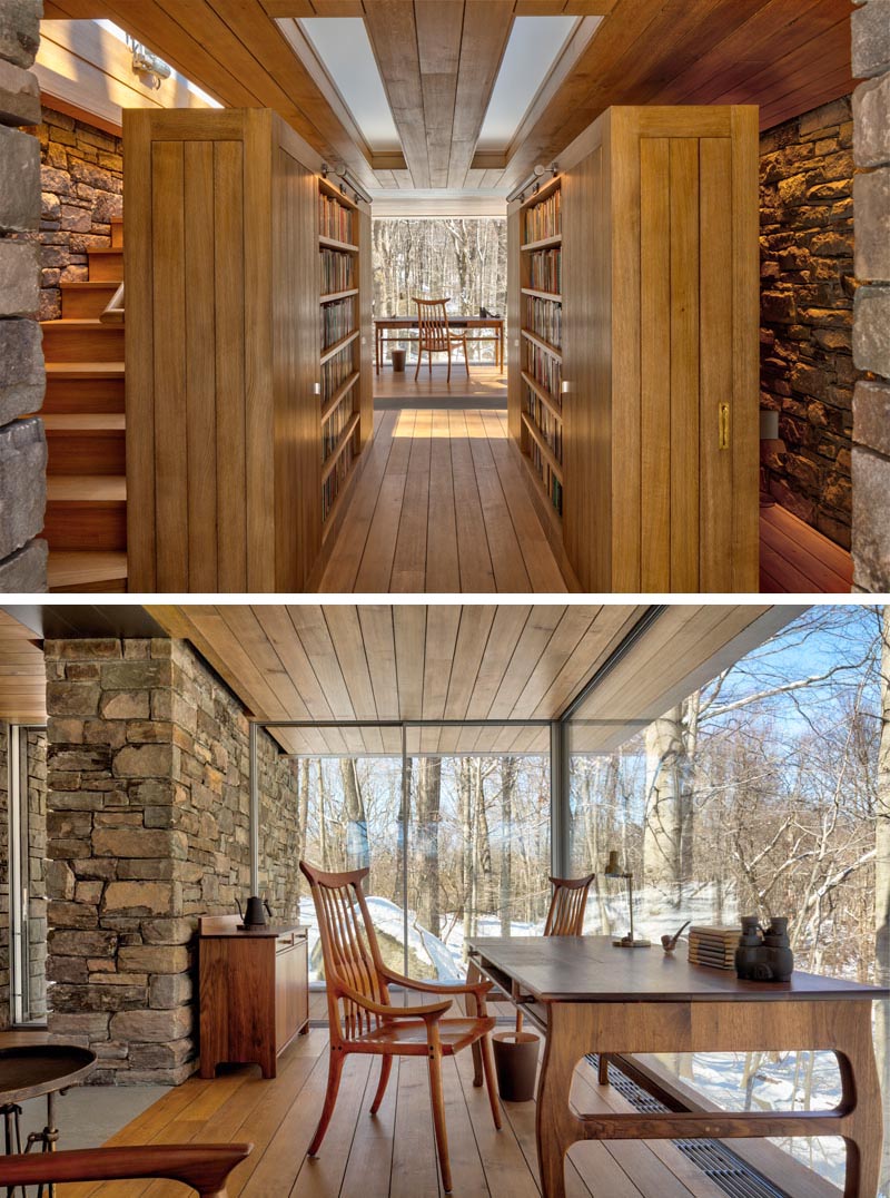 The glass-enclosed writer’s space which is cantilevered over the hill, has uninterrupted views along a 16-foot window wall. #WritersCabin #Cabin #Studio #GlassWalls