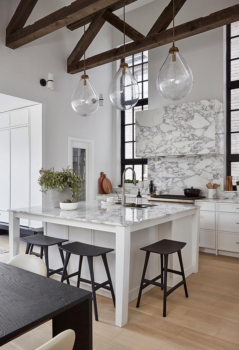 A Square Kitchen Island Includes Casual Seating In This Toronto Home