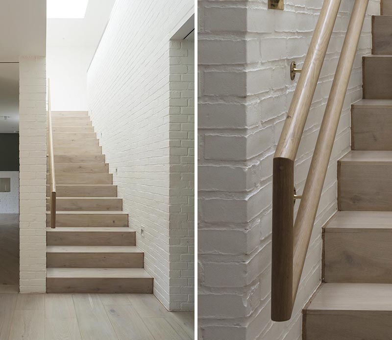 Architecture firm Peter Legge Associates completed a house in Dublin, Ireland, and as part of the design of the stairs, they included a wood handrail that can be used by both adults and children. #StairDesign #HandrailDesign #MultiHeightHandrail
