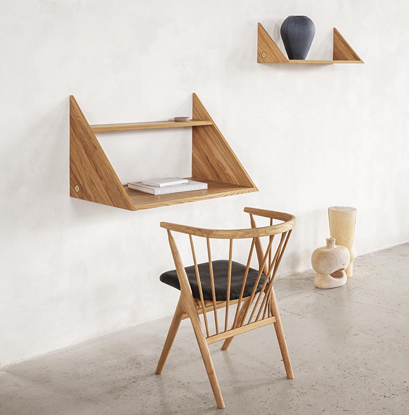 A modern floating wall desk with matching shelf.