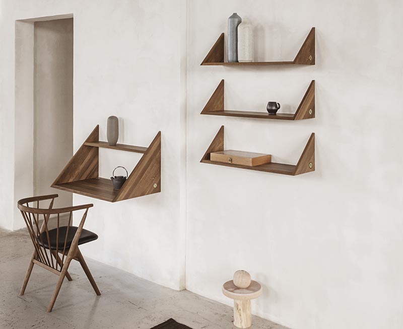 A modern wood wall desk with matching shelving.