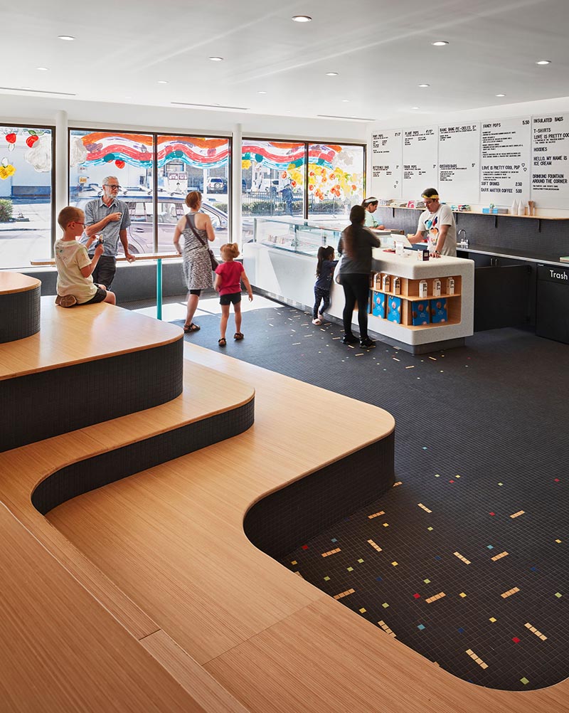In the recently completed Pretty Cool Ice Cream Shop in Chicago, Illinois, Tumu Studio created a sculptural tiered seating element for visitors of the shop to relax on. #TieredSeating #RetailDesign #IceCreamShop #InteriorDesign
