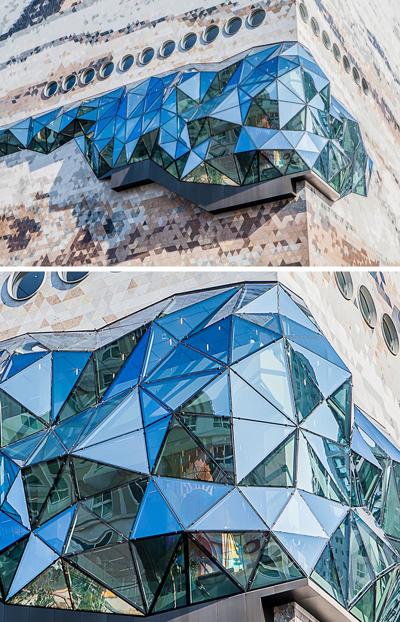The Galleria department store has a textured mosaic stone facade with multifaceted glass accents that were inspired by the nature of the neighboring park. #DepartmentStore #Architecture #Windows #Facade #BuildingFacade