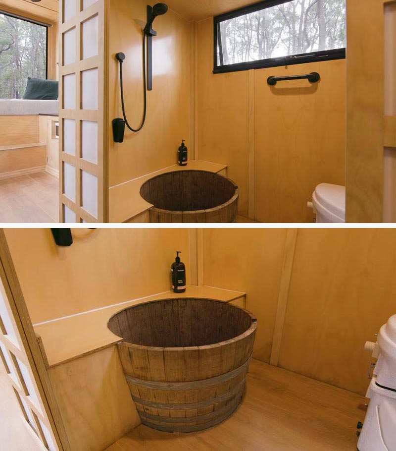 Inside the bathroom of this modern tiny house, is a waterproofed wine barrel that acts as a shower tub. #TinyHouse #TinyHome #Bathroom #WineBarrelBath