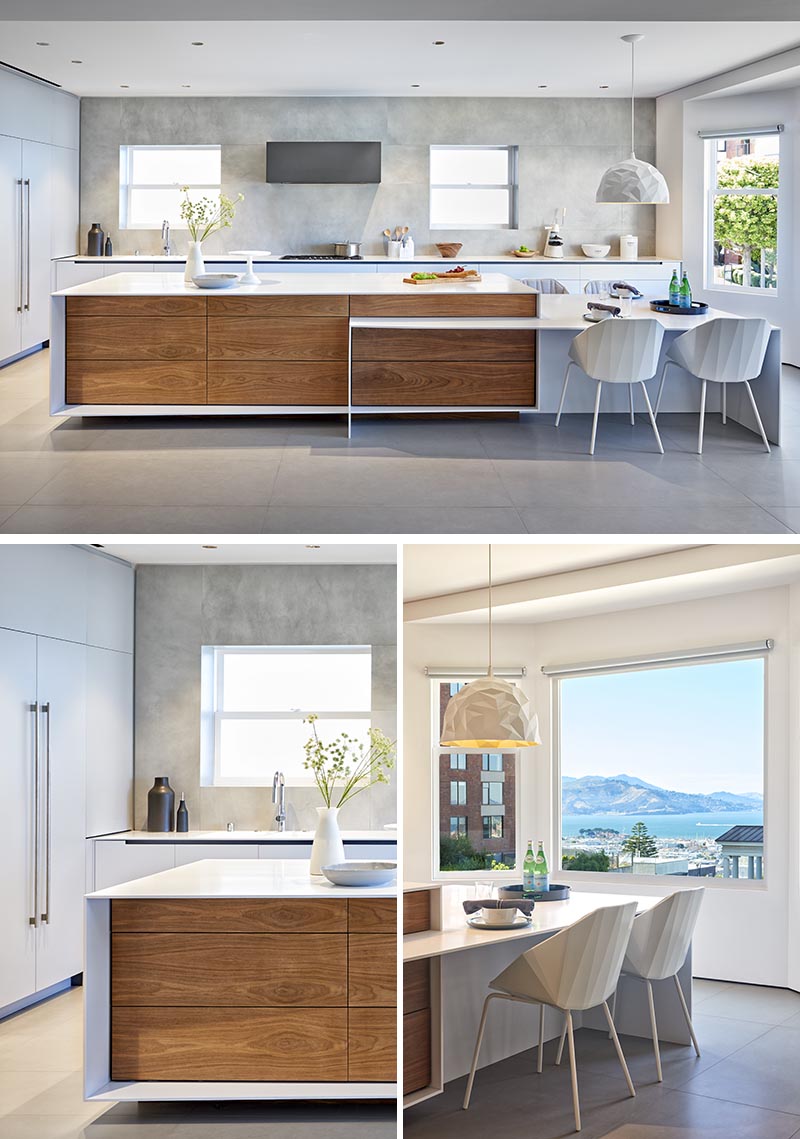 This modern kitchen has plenty of windows, minimalist cabinets, and white countertops with matching white furniture to ensure that the space is bright and welcoming. #ModernKitchen #KitchenDesign #KitchenIdeas #BrightKitchen
