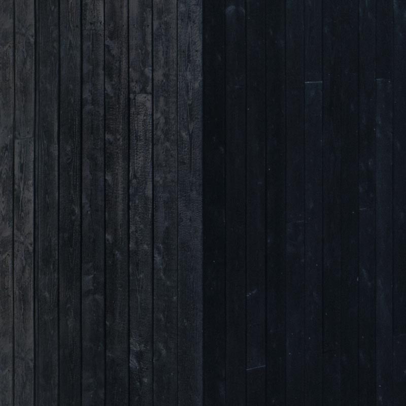 This modern black house has charred wood siding that offers a layer of waterproofing and preservation. #ShouSugiBan #CharredWoodSiding #BlackCladding #BlackHouseSiding #BlackWoodSiding #Architecture