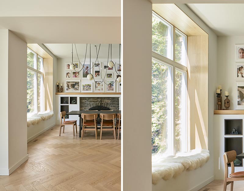 Lined with wood and cushioned with sheepskin, this modern built-in window seat looks out to the tall trees in the garden. #WindowSeat #ModernInterior #InteriorDesign